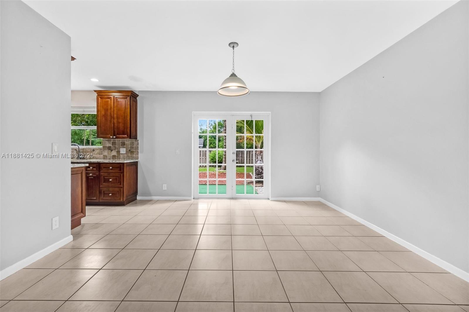 5119 Oak Hill Road Delray Beach, FL 33484 - Photo 14 of 48 a view of an empty room with a window
