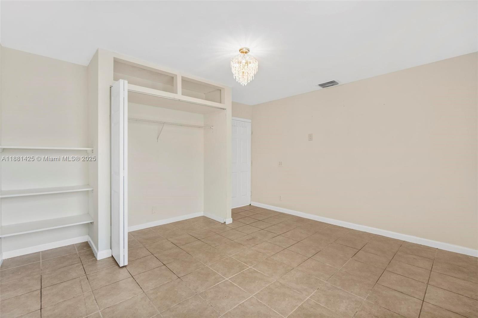 5119 Oak Hill Road Delray Beach, FL 33484 - Photo 18 of 48 a view of an empty room