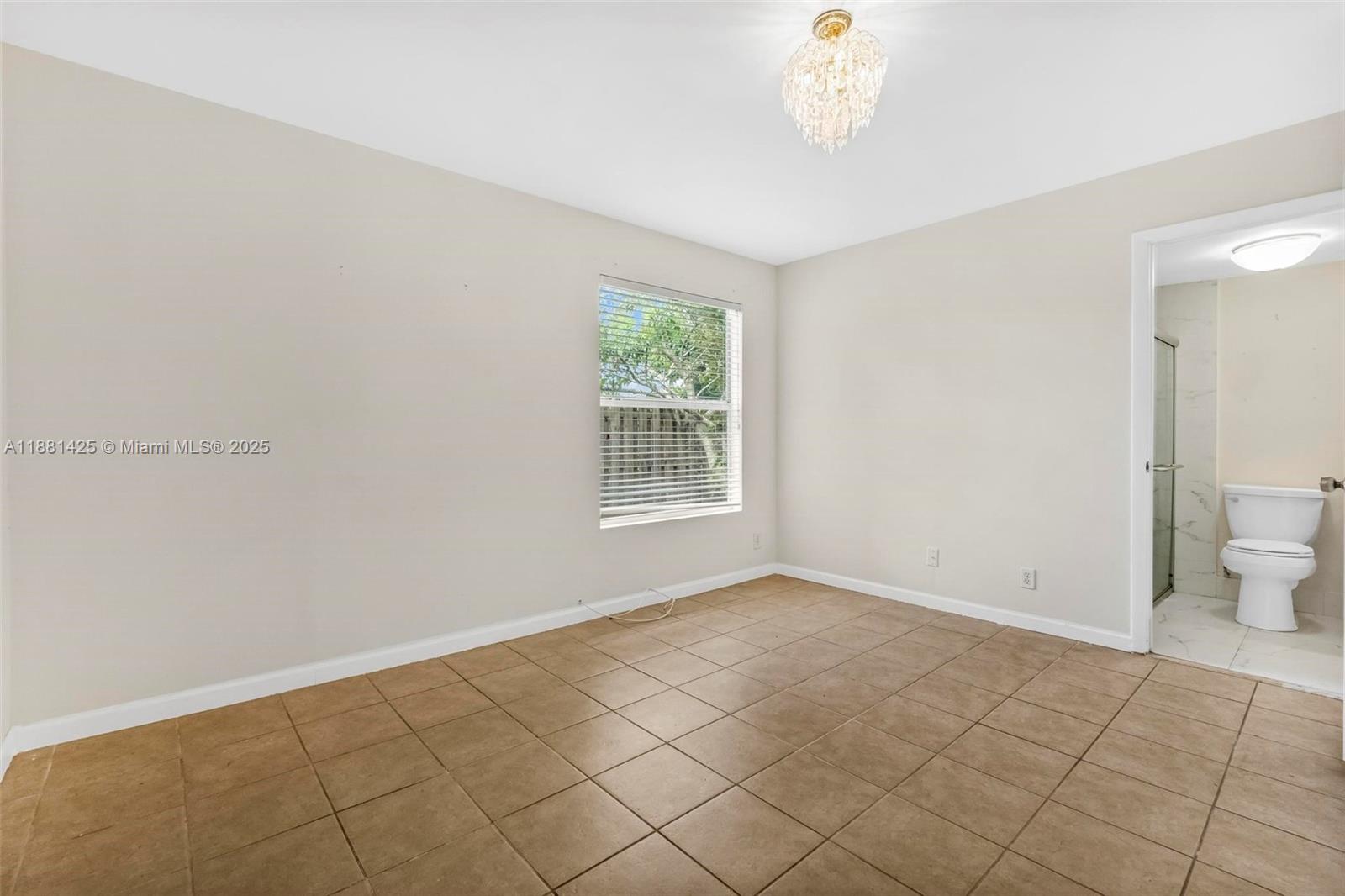 5119 Oak Hill Road Delray Beach, FL 33484 - Photo 19 of 48 a view of an empty room with a window