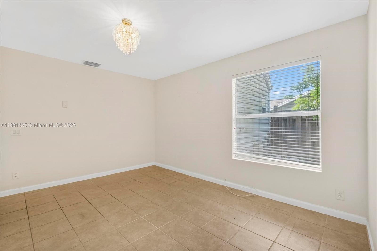 5119 Oak Hill Road Delray Beach, FL 33484 - Photo 20 of 48 a view of an empty room with a window