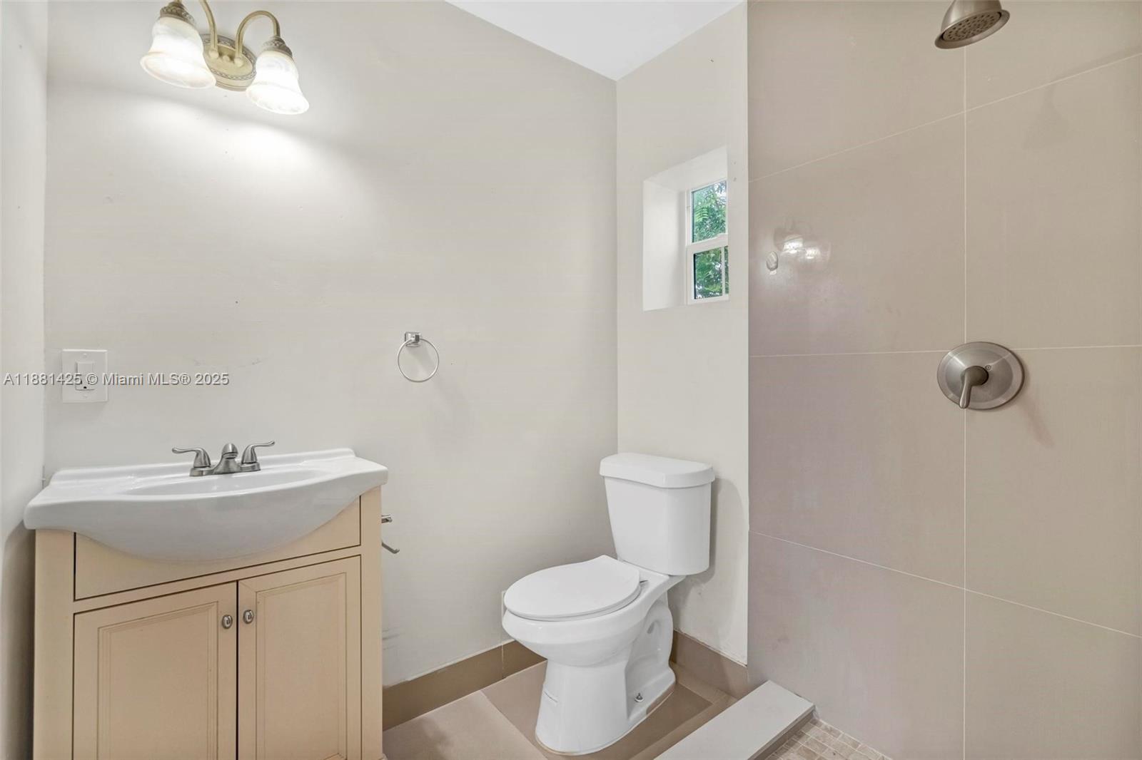 5119 Oak Hill Road Delray Beach, FL 33484 - Photo 33 of 48 a bathroom with a toilet sink and mirror