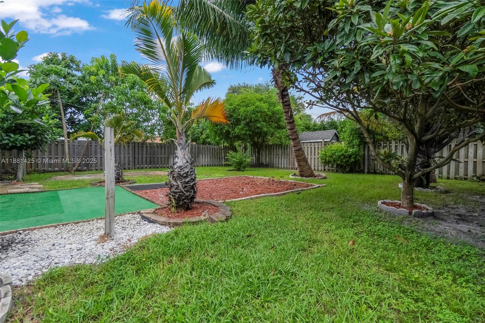 5119 Oak Hill Road Delray Beach, FL 33484 - Photo 38 of 48 a view of a park with a tree