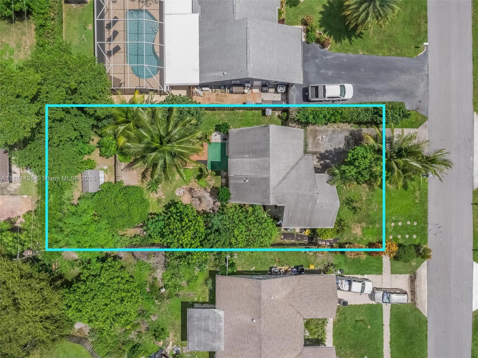 5119 Oak Hill Road Delray Beach, FL 33484 - Photo 4 of 48 an aerial view of a house with a garden