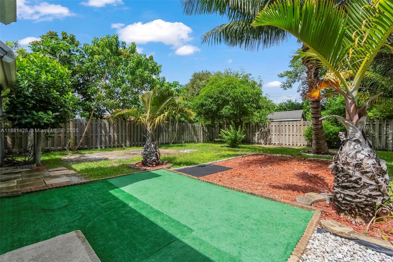 5119 Oak Hill Road Delray Beach, FL 33484 - Photo 41 of 48 a front view of a house with garden