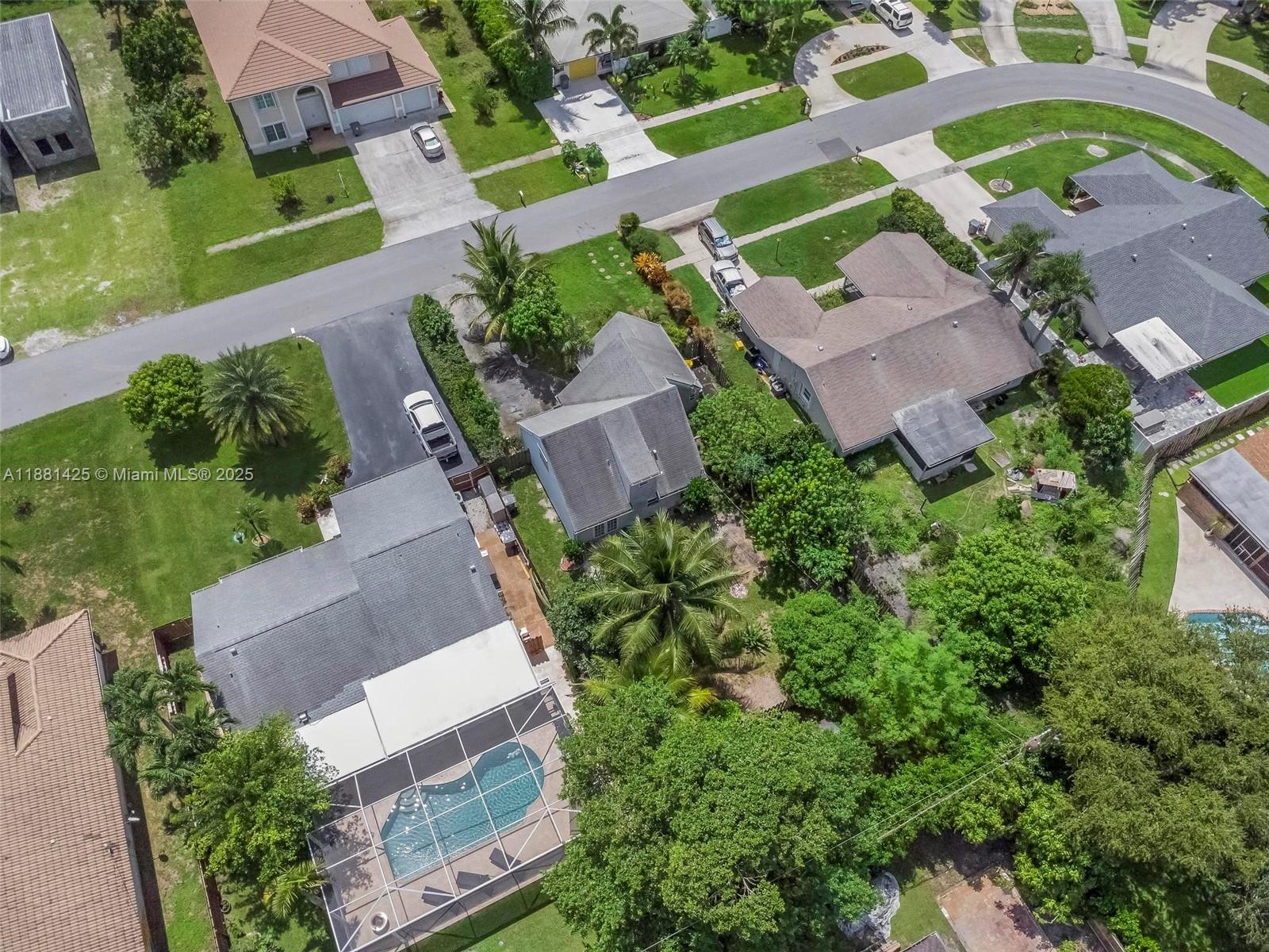 5119 Oak Hill Road Delray Beach, FL 33484 - Photo 43 of 48 an aerial view of a house with a garden