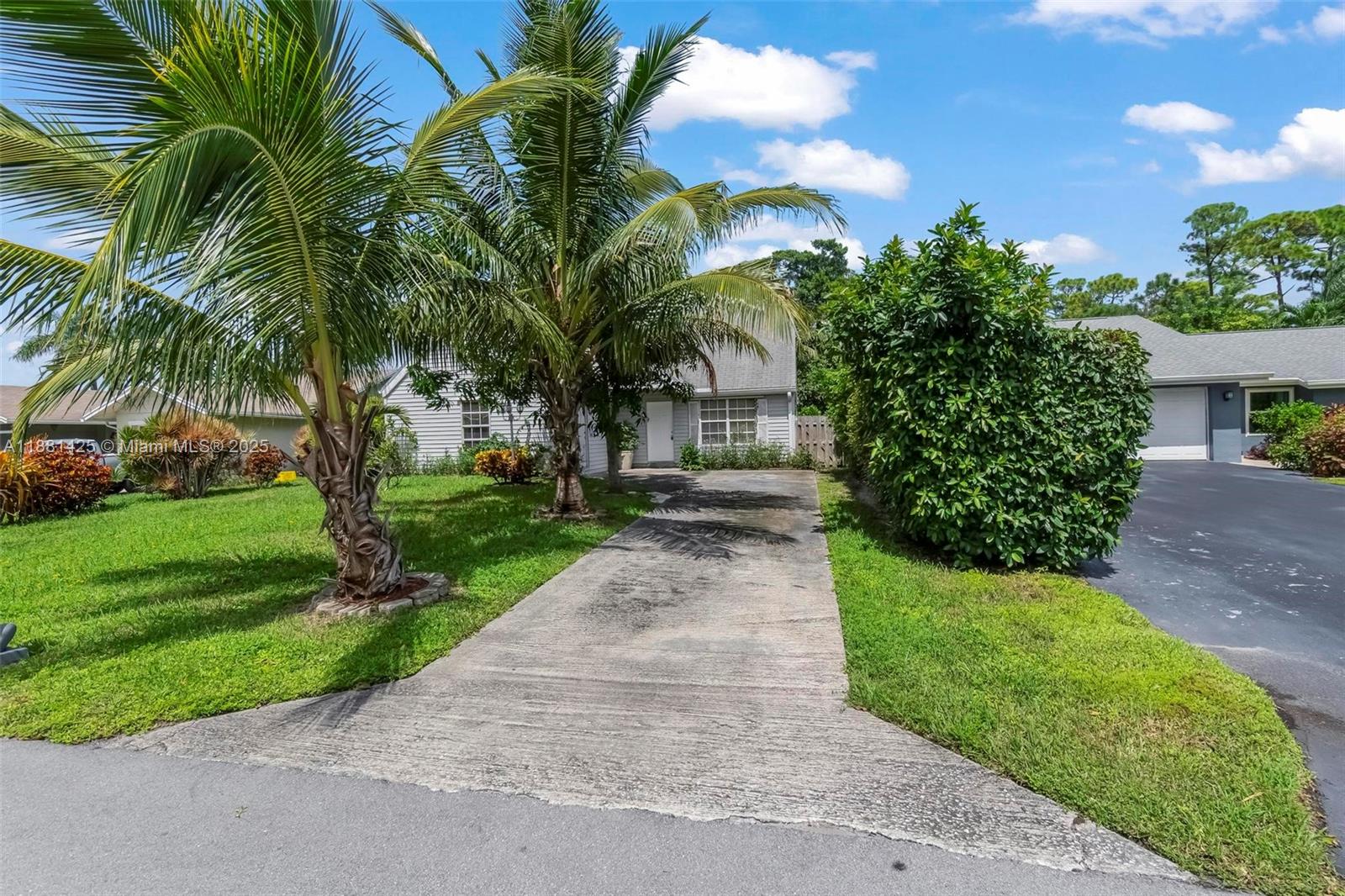 5119 Oak Hill Road Delray Beach, FL 33484 - Photo 46 of 48 a view of a yard with palm trees
