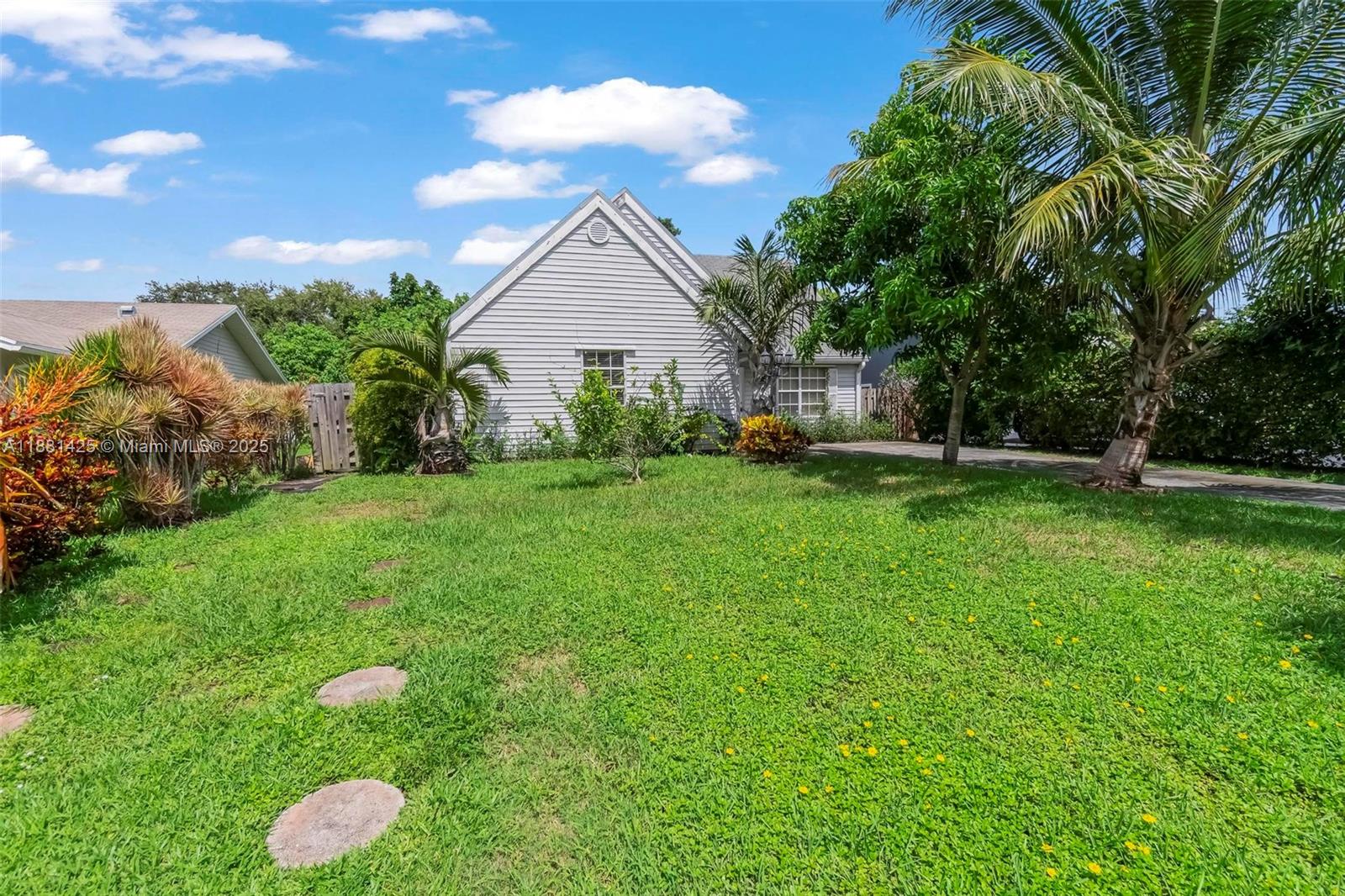 5119 Oak Hill Road Delray Beach, FL 33484 - Photo 47 of 48 a front view of a house with garden