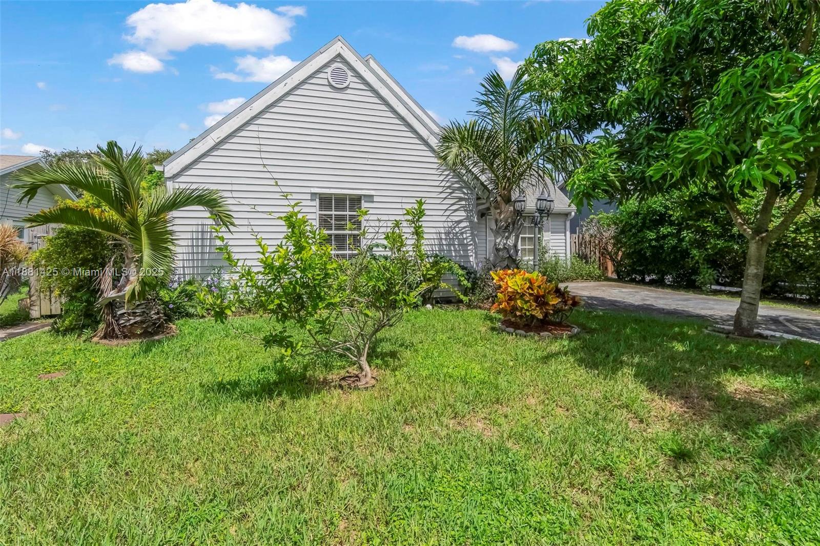 5119 Oak Hill Road Delray Beach, FL 33484 - Photo 48 of 48 a front view of house with yard and trees