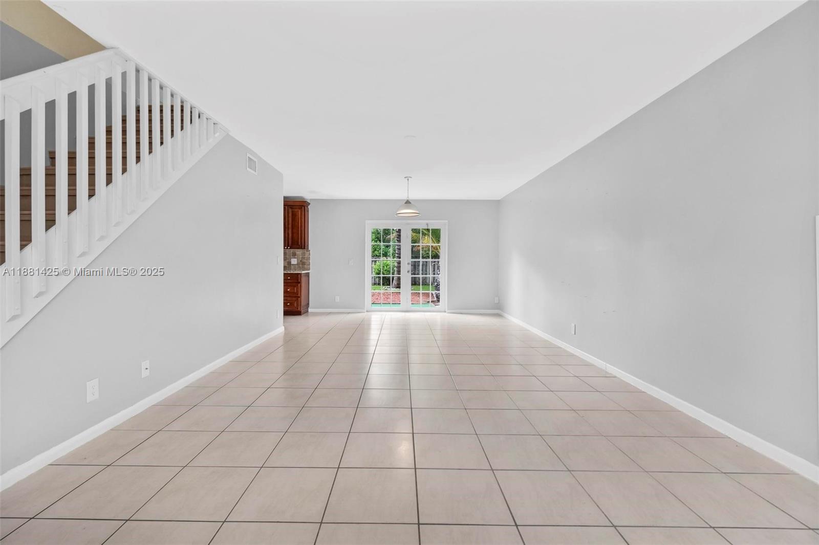 5119 Oak Hill Road Delray Beach, FL 33484 - Photo 7 of 48 a view of an empty room with a window