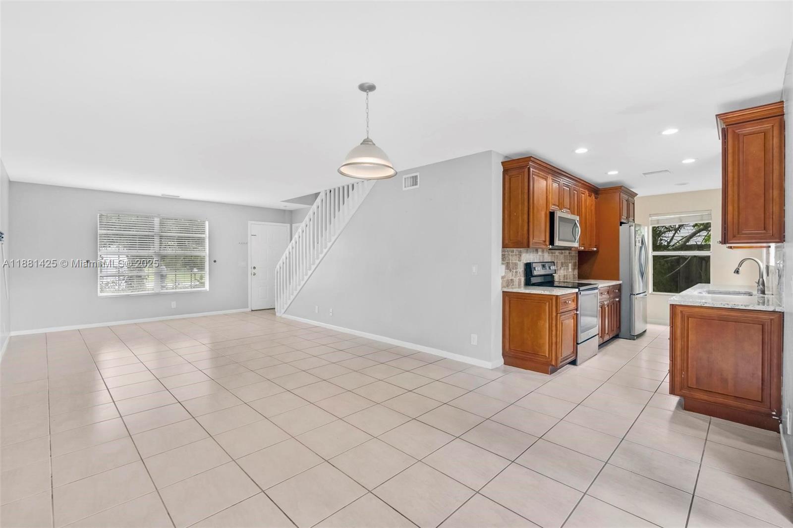 5119 Oak Hill Road Delray Beach, FL 33484 - Photo 9 of 48 a view of kitchen appliances and cabinets