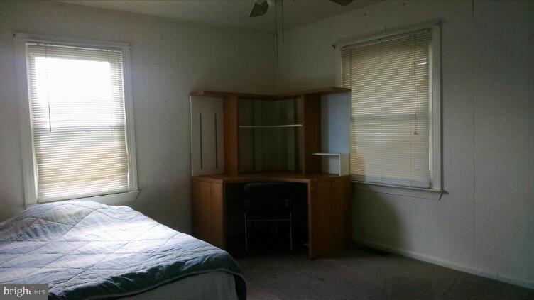 1091 Lower Pindell Road Lothian, MD 20711 - Photo 11 of 26 a bedroom with a bed and a window