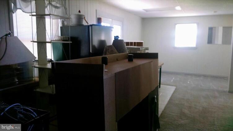 1091 Lower Pindell Road Lothian, MD 20711 - Photo 17 of 26 a kitchen with refrigerator and window