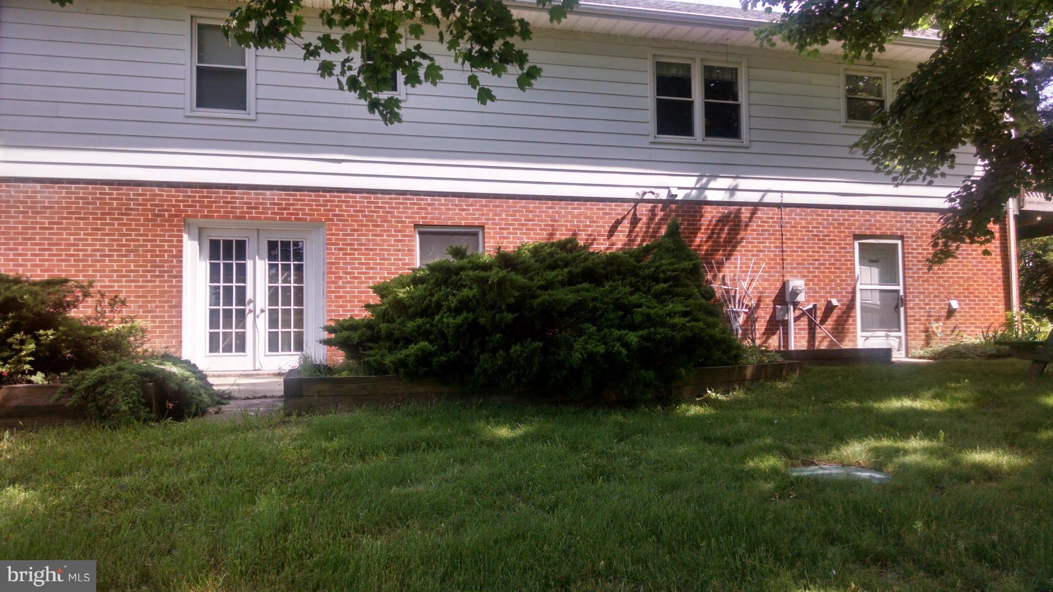 1091 Lower Pindell Road Lothian, MD 20711 - Photo 3 of 26 a view of a house with a garden