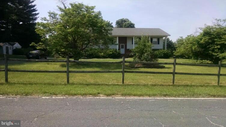 1091 Lower Pindell Road Lothian, MD 20711 - Photo 22 of 26 a front view of a house with a yard