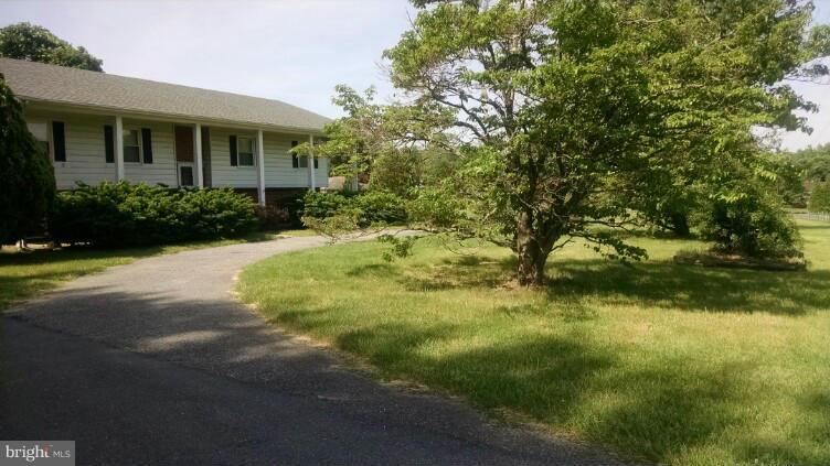 1091 Lower Pindell Road Lothian, MD 20711 - Photo 24 of 26 a view of a house with a yard
