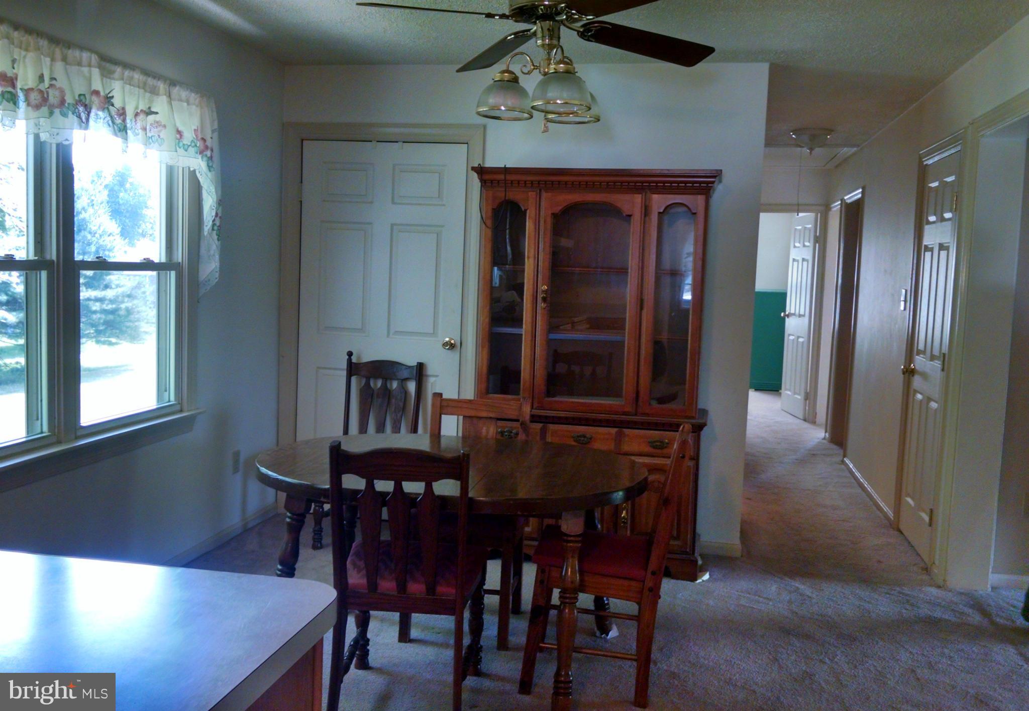 1091 Lower Pindell Road Lothian, MD 20711 - Photo 6 of 26 a view of a dining room with furniture window and wooden floor