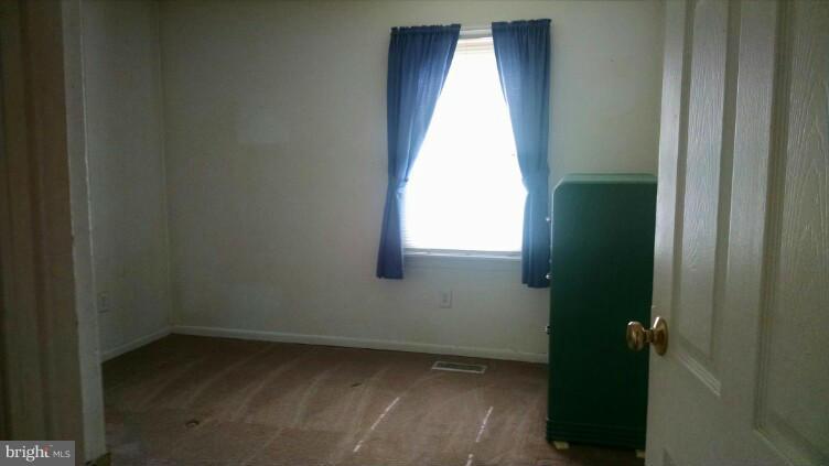 1091 Lower Pindell Road Lothian, MD 20711 - Photo 8 of 26 a view of an empty room and window