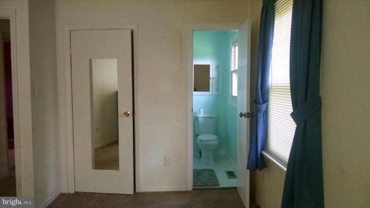 1091 Lower Pindell Road Lothian, MD 20711 - Photo 9 of 26 a view of a bathroom from a corridor