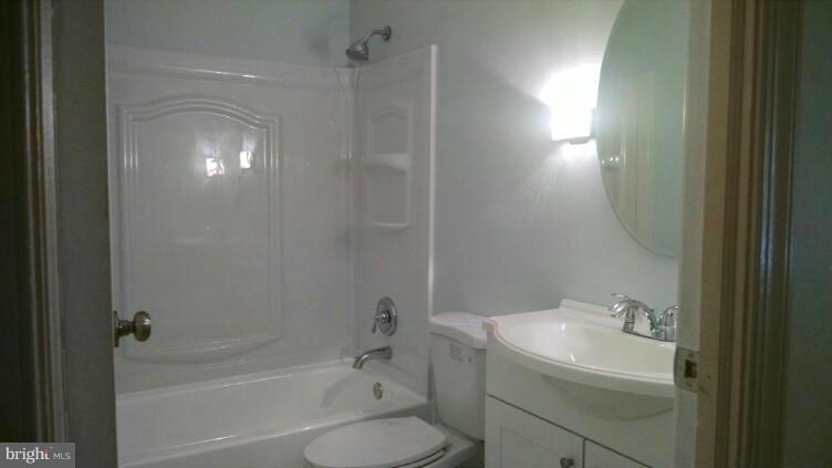 1091 Lower Pindell Road Lothian, MD 20711 - Photo 10 of 26 a bathroom with a sink toilet and shower