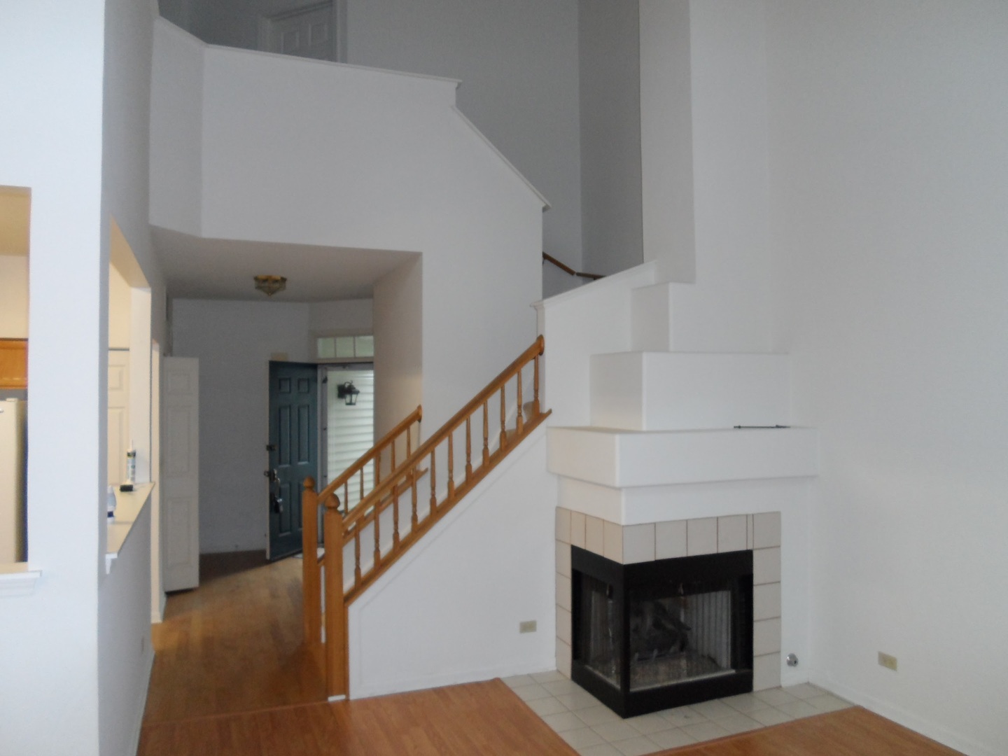 Undisclosed Address Hoffman Estates, IL 60169 - Photo 3 of 15 a view of a livingroom with a fireplace and stairs