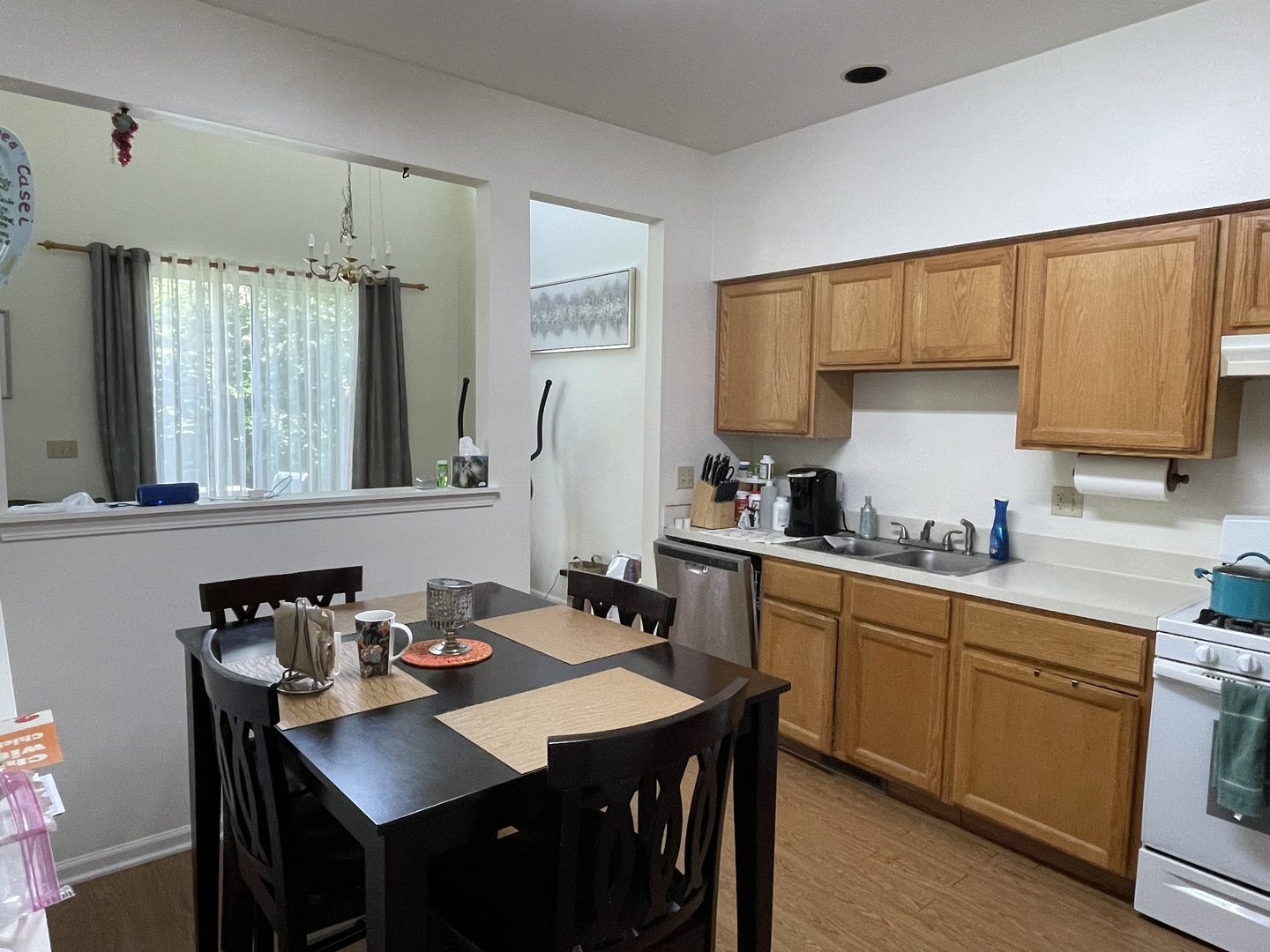 Undisclosed Address Hoffman Estates, IL 60169 - Photo 6 of 15 a kitchen with a sink stove and cabinets