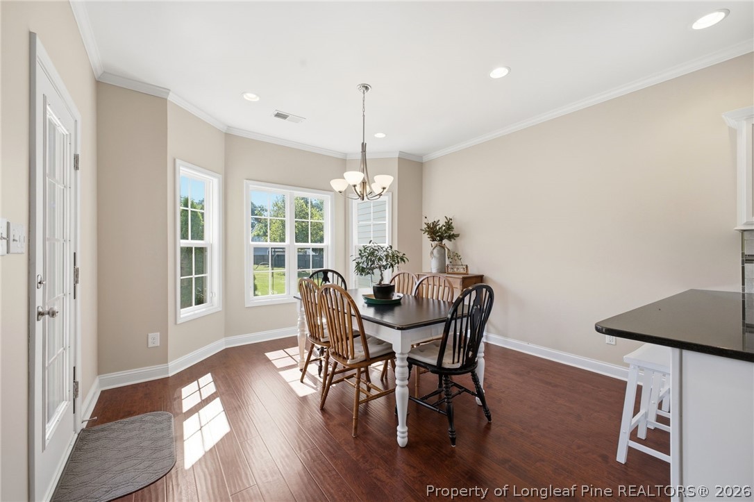 2589 June Johnson Road Raeford, NC 28376 - Photo 7 of 49 a view of a dining room with furniture window and wooden floor