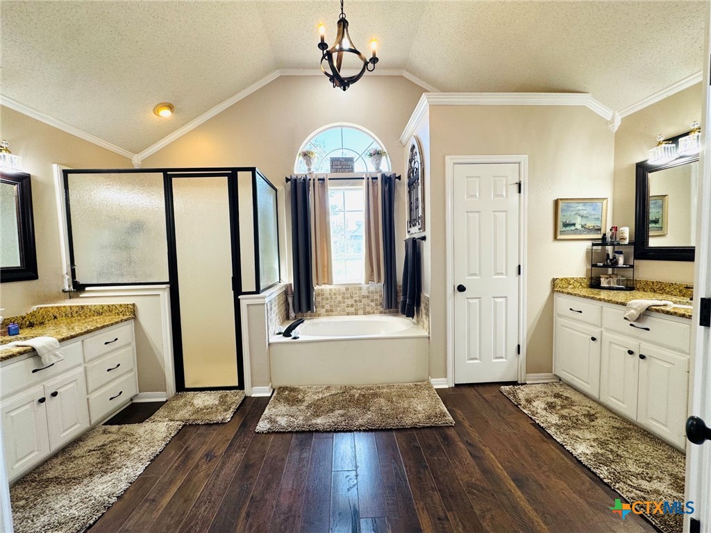 115 Oak Ridge Road Gatesville, TX 76528 - Photo 21 of 37 a bathroom with a granite countertop sink a mirror and shower