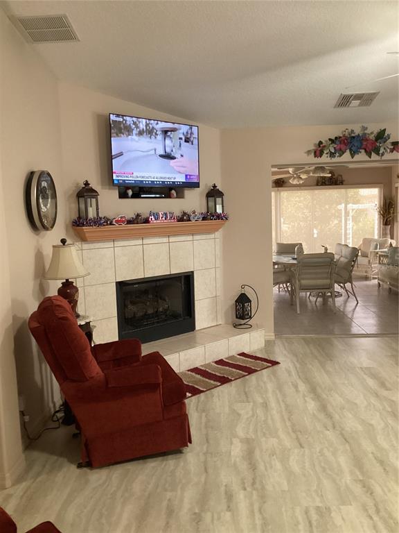 15680 Southwest 13th Circle Ocala, FL 34473 - Photo 15 of 75 a living room with furniture and a fireplace