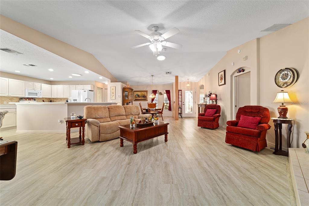 15680 Southwest 13th Circle Ocala, FL 34473 - Photo 19 of 75 a living room with furniture and wooden floor