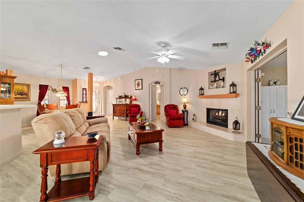 15680 Southwest 13th Circle Ocala, FL 34473 - Photo 20 of 75 a living room with furniture and a fireplace