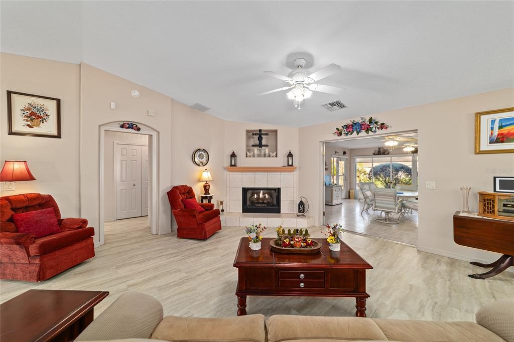 15680 Southwest 13th Circle Ocala, FL 34473 - Photo 21 of 75 a living room with furniture or couch and a fireplace