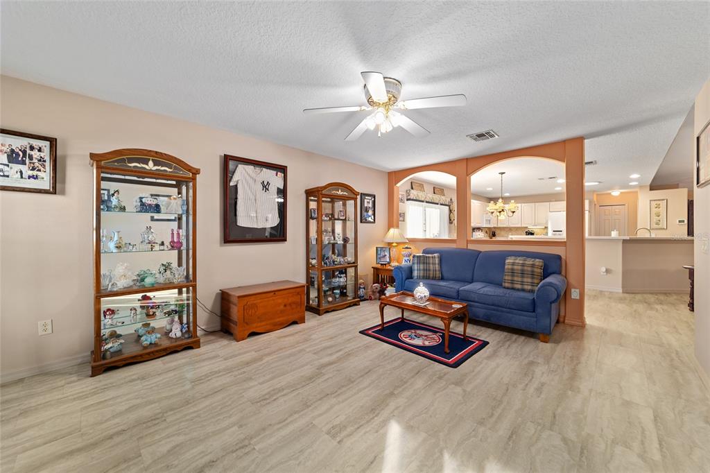 15680 Southwest 13th Circle Ocala, FL 34473 - Photo 24 of 75 a living room with furniture gym equipment and a large window