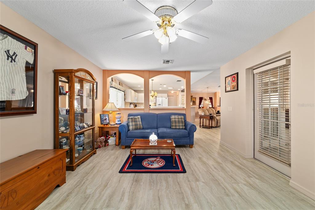 15680 Southwest 13th Circle Ocala, FL 34473 - Photo 25 of 75 a living room with furniture fireplace and flat screen tv