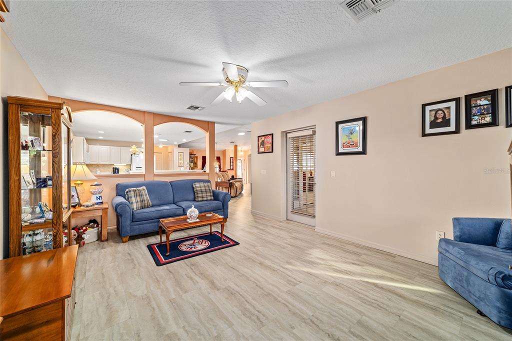 15680 Southwest 13th Circle Ocala, FL 34473 - Photo 26 of 75 a living room with furniture and a large window