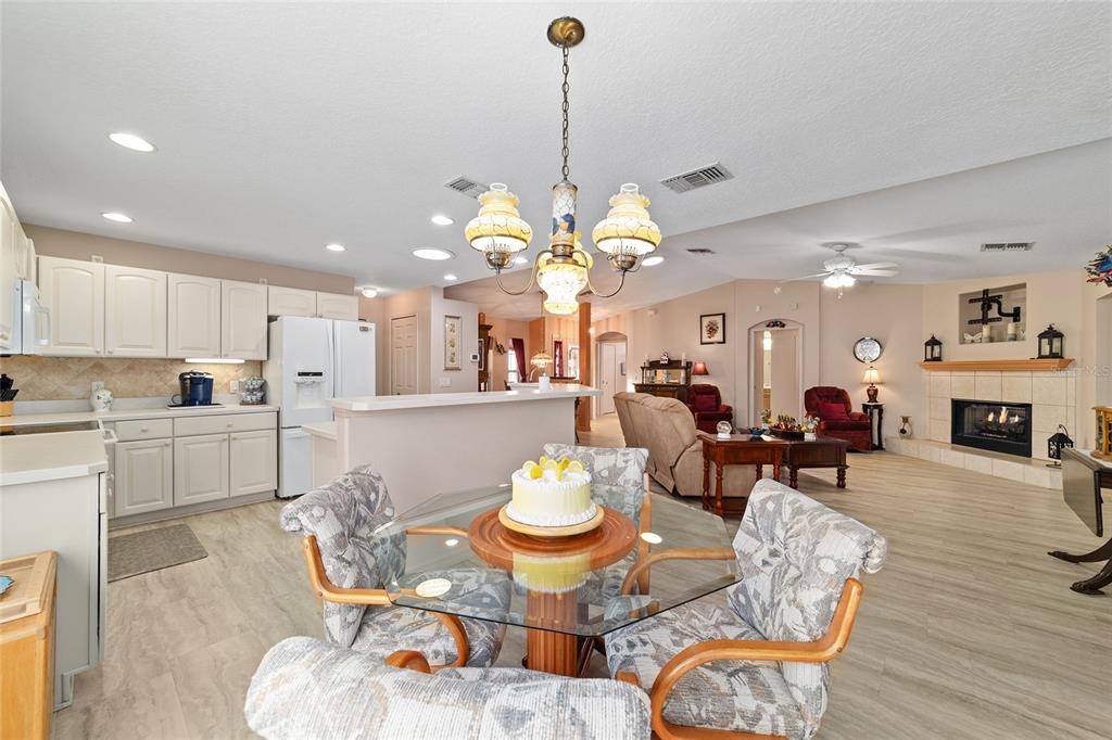 15680 Southwest 13th Circle Ocala, FL 34473 - Photo 28 of 75 a living room with fireplace furniture and a dining table