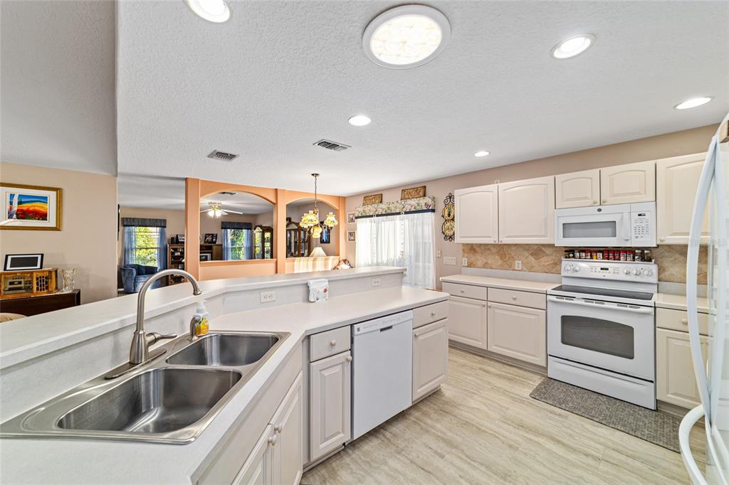 15680 Southwest 13th Circle Ocala, FL 34473 - Photo 33 of 74 a kitchen with a sink and cabinets