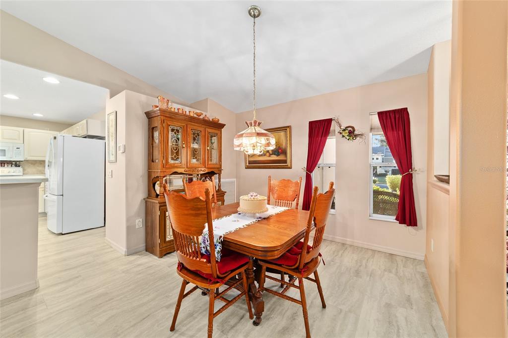 15680 Southwest 13th Circle Ocala, FL 34473 - Photo 39 of 75 a dining room with furniture and window