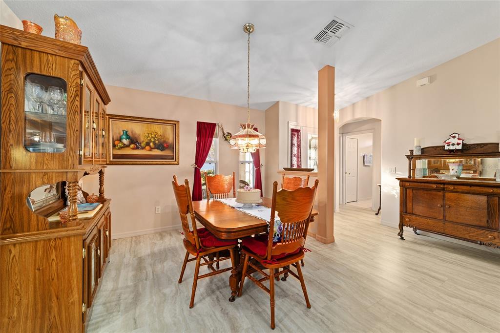 15680 Southwest 13th Circle Ocala, FL 34473 - Photo 40 of 75 a view of a dining room with furniture window and wooden floor