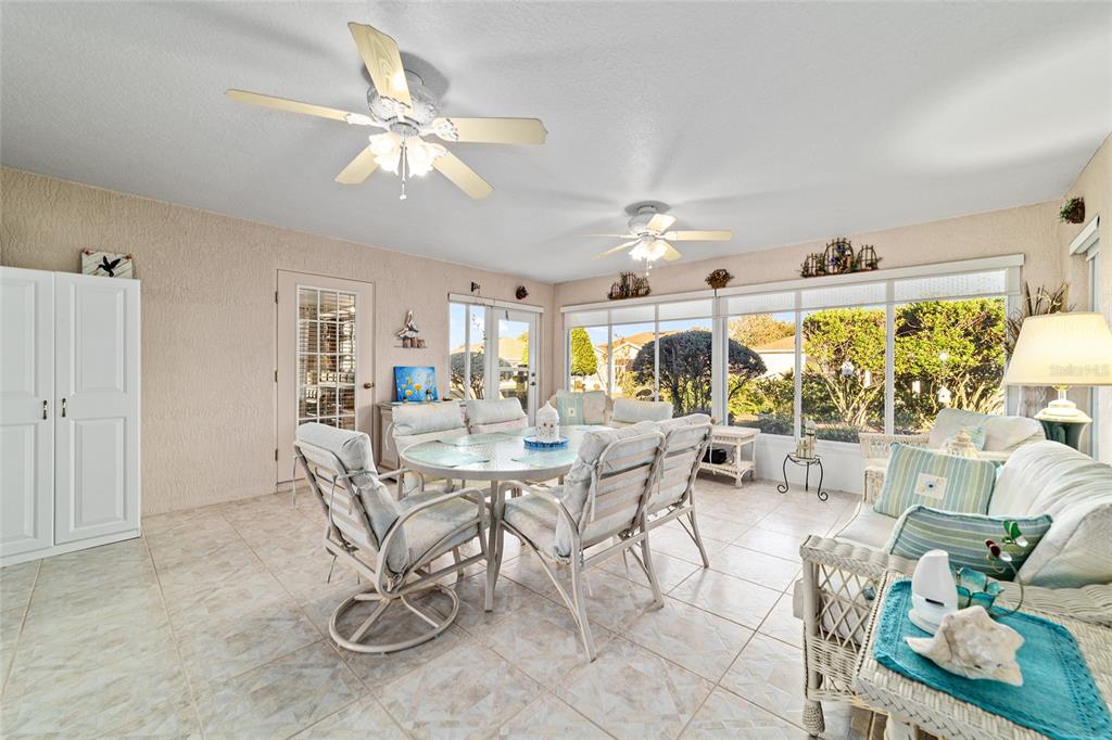 15680 Southwest 13th Circle Ocala, FL 34473 - Photo 42 of 75 a view of a dining room with furniture and chandelier
