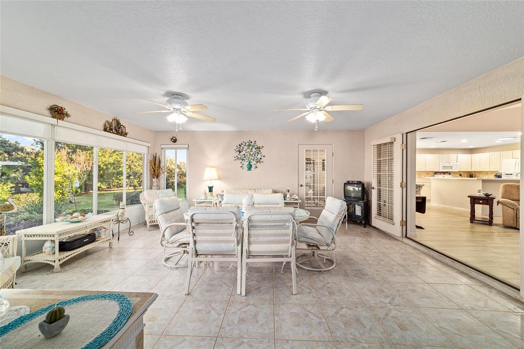 15680 Southwest 13th Circle Ocala, FL 34473 - Photo 43 of 75 a living room with furniture a large window with outer view