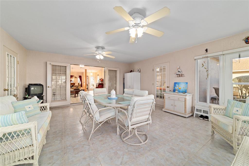 15680 Southwest 13th Circle Ocala, FL 34473 - Photo 44 of 75 a view of a livingroom with furniture and a large window