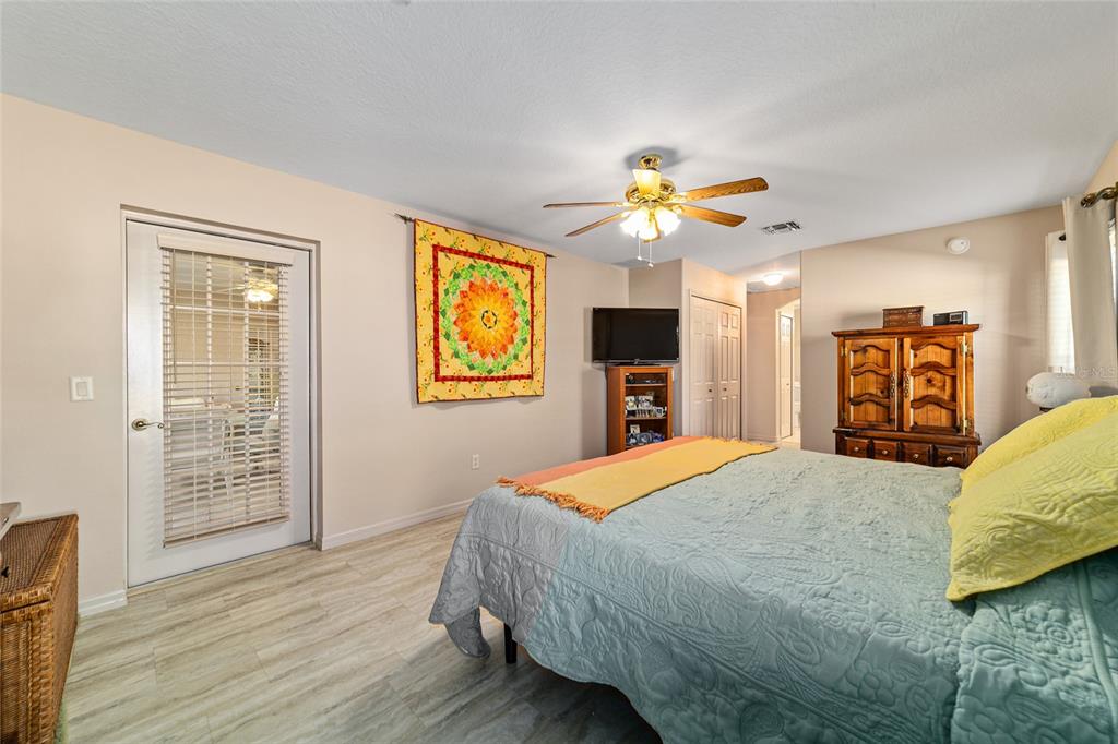 15680 Southwest 13th Circle Ocala, FL 34473 - Photo 50 of 75 a bedroom with a bed and a television