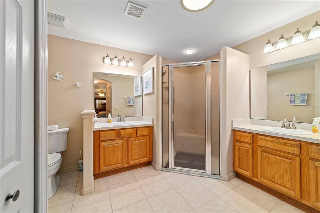 15680 Southwest 13th Circle Ocala, FL 34473 - Photo 51 of 74 a spacious bathroom with a shower sink and mirror
