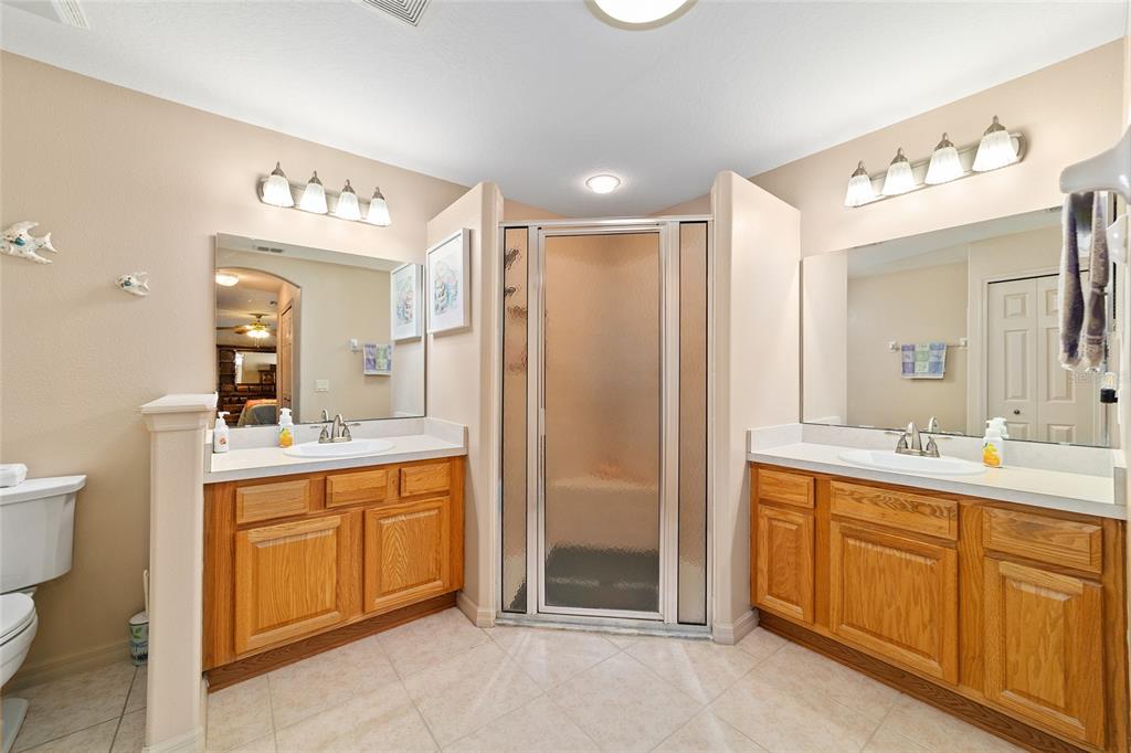 15680 Southwest 13th Circle Ocala, FL 34473 - Photo 53 of 75 a spacious bathroom with a double vanity sink mirror and toilet