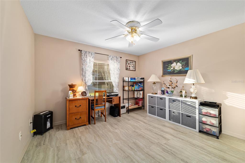 15680 Southwest 13th Circle Ocala, FL 34473 - Photo 61 of 74 a view of a workspace with furniture and a window