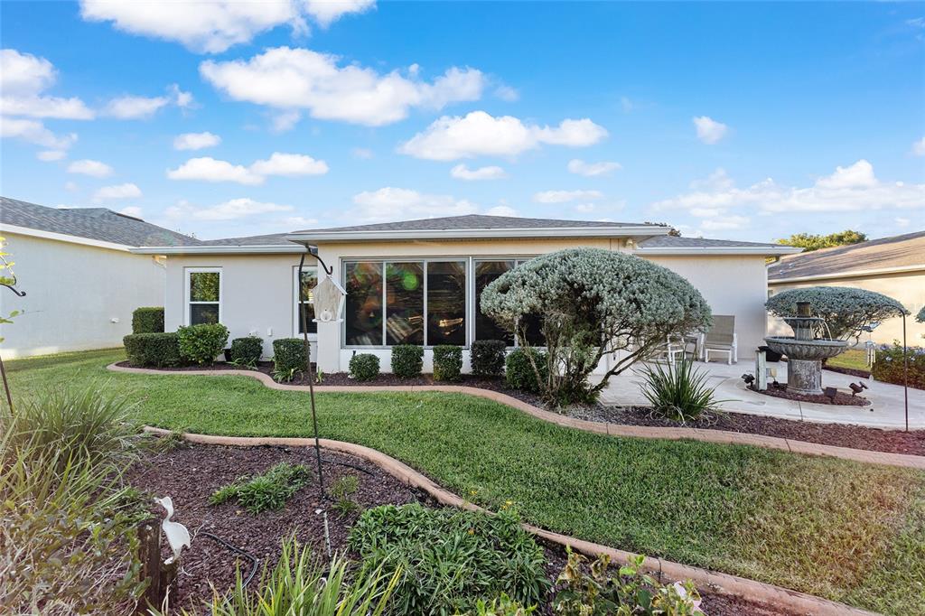 15680 Southwest 13th Circle Ocala, FL 34473 - Photo 67 of 74 a view of a backyard with sitting area and garden