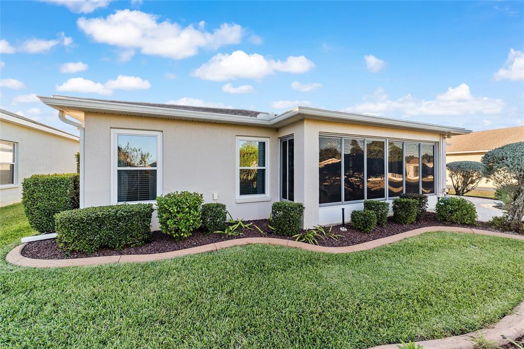 15680 Southwest 13th Circle Ocala, FL 34473 - Photo 69 of 75 a view of a house with backyard garden and porch