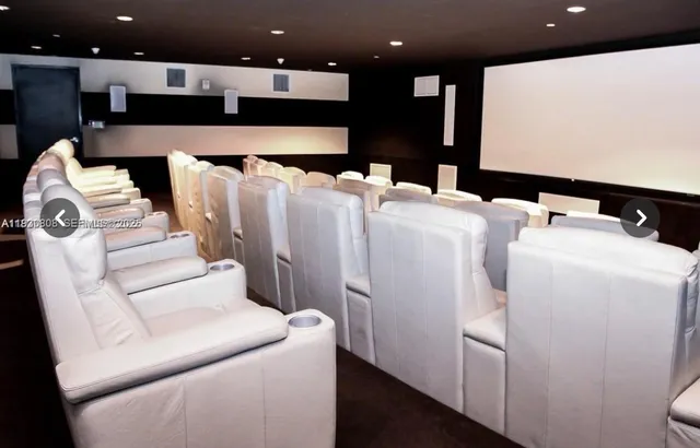 a living room with furniture and a projector