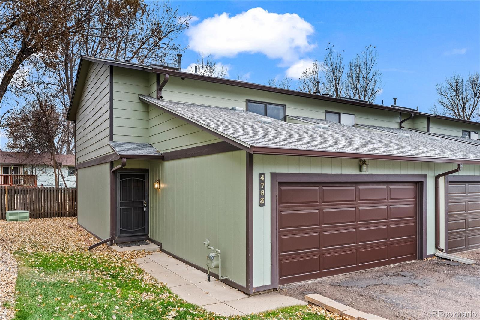 4763 Barnes Road Colorado Springs, CO 80917 - Photo 1 of 21 a front view of a house with a yard