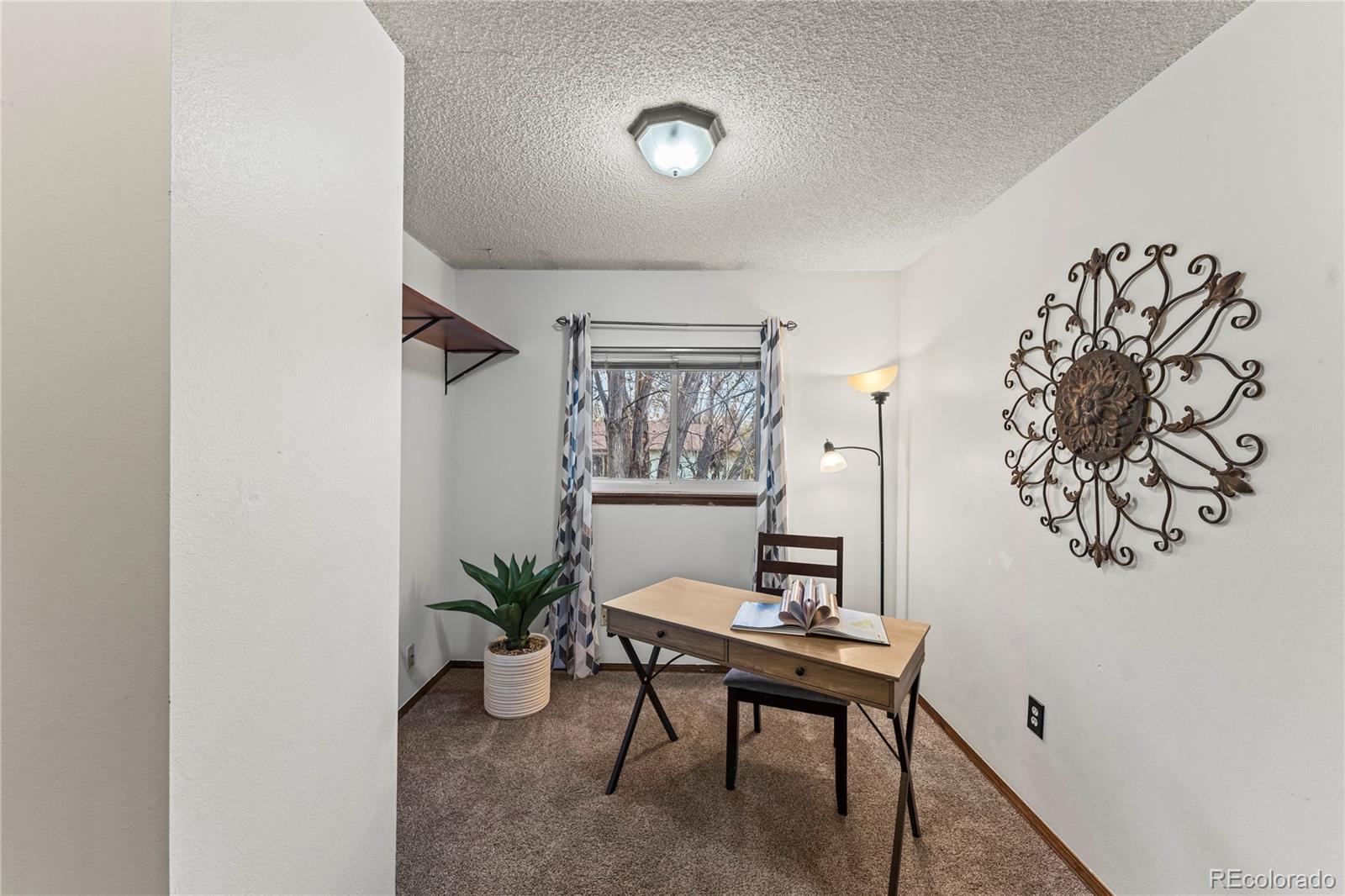 4763 Barnes Road Colorado Springs, CO 80917 - Photo 13 of 21 a view of a workspace with furniture